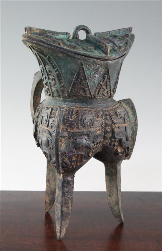 A Chinese archaistic bronze jue vessel and cover, 29cm, damage